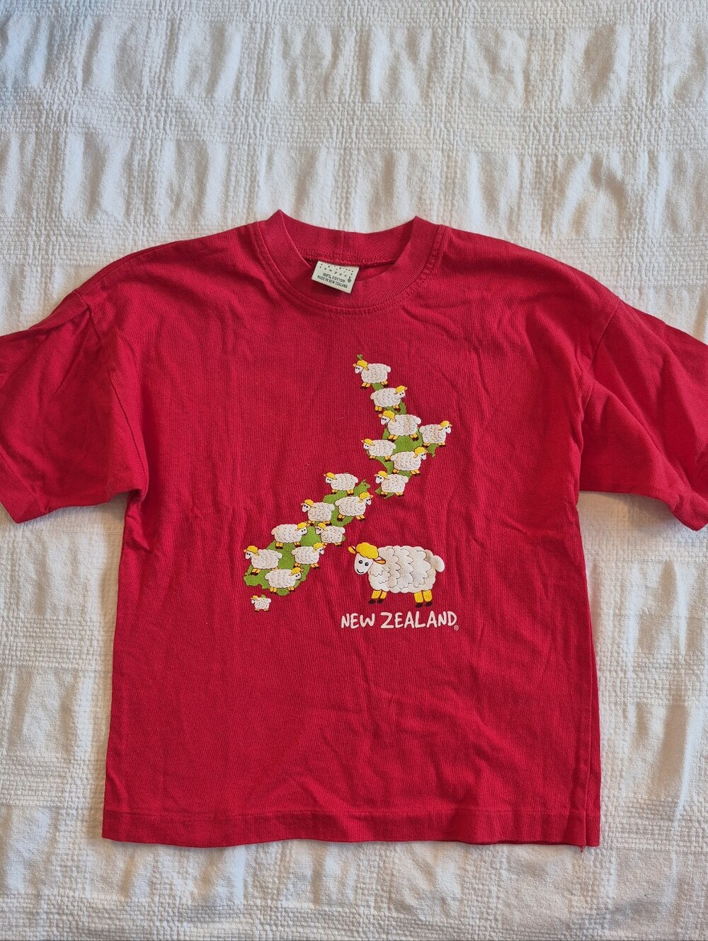 New Zealand boys size 6 years red tshirt with sheep print design loose fit VGUC